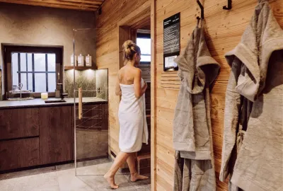 Guest in the sauna area of the Dillhof Apartments