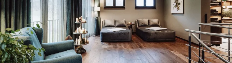 Living area of an apartment with sofa and dining table